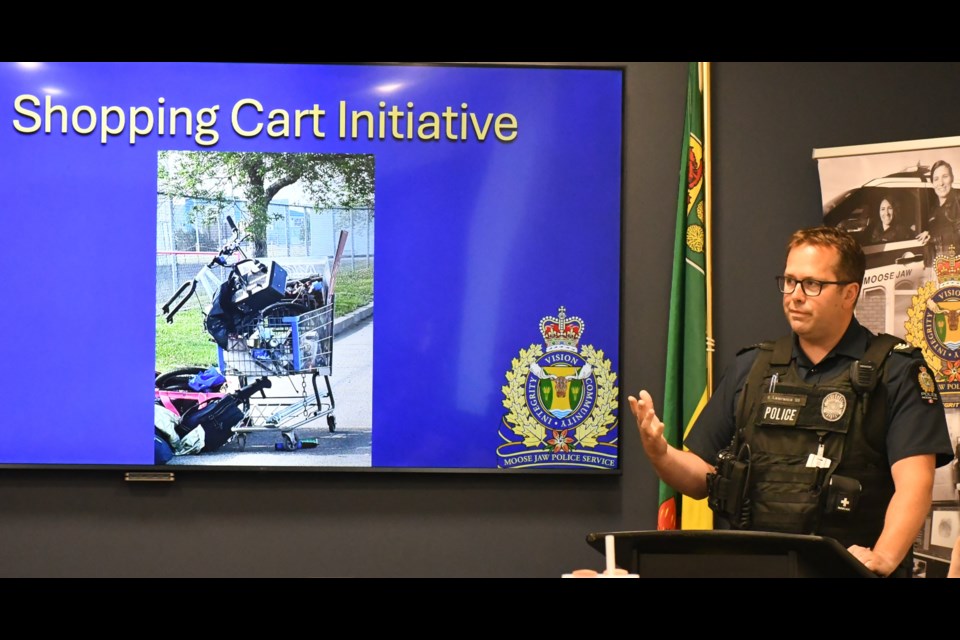 Sgt. Ryan Lawrence speaks to the police board about a new project to combat theft of shopping carts. Photo by Jason G. Antonio