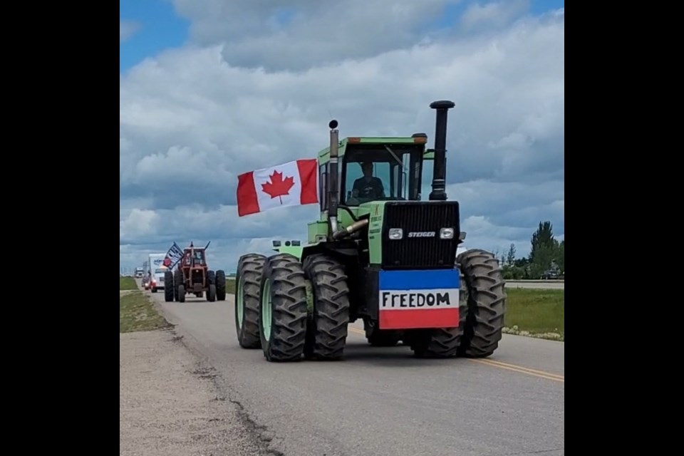 A farm tractor leads the way during a slow roll to Regina to support Dutch farmers. Photo courtesy Robin Mitchell