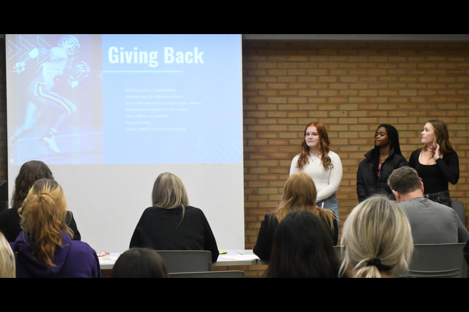 Three students from Yorkton Regional High School's team 2 present their business case during the competition. Photo by Jason G. Antonio