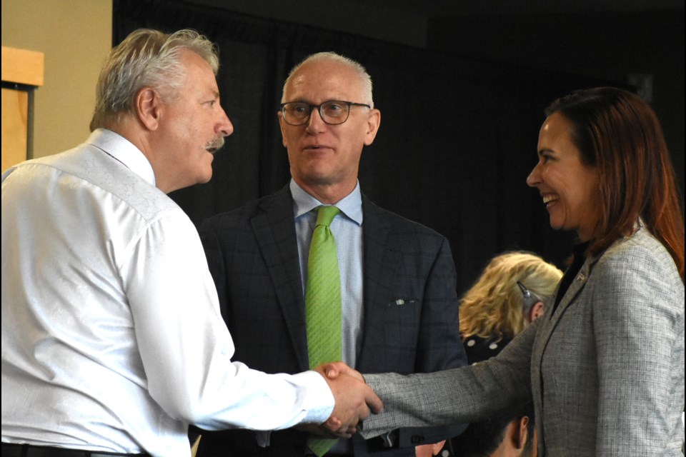 Mayor Clive Tolley (left) meets staff from Saskatchewan Polytechnic's head office before the start of the luncheon. Photo by Jason G. Antonio