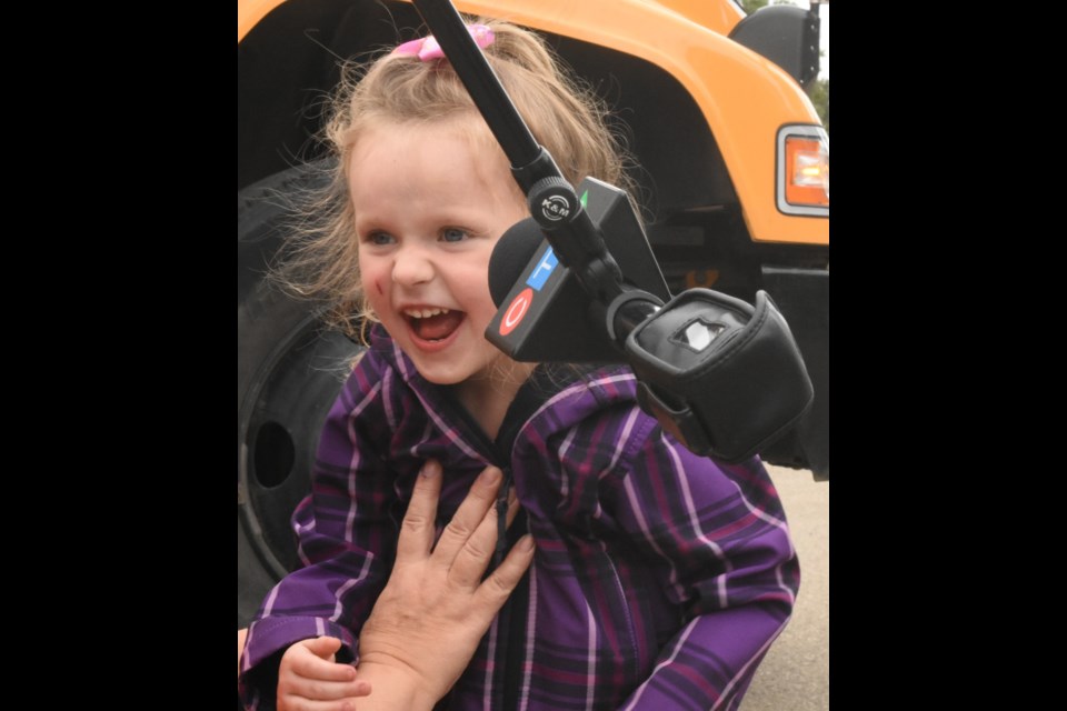 Pre-kindergarten student Auorihnna Gueffroy-Pomeroy is excited to meet the media before the start of the bus safety program. Photo by Jason G. Antonio 