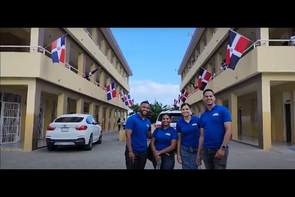 A group of teachers from Un Mañana Brillante/Brighter Tomorrow Outreach stands in front of a high school in the Dominican Republic. The educators — supported by people in Moose Jaw and Saskatchewan — teach religious education in the country. Photo courtesy YouTube