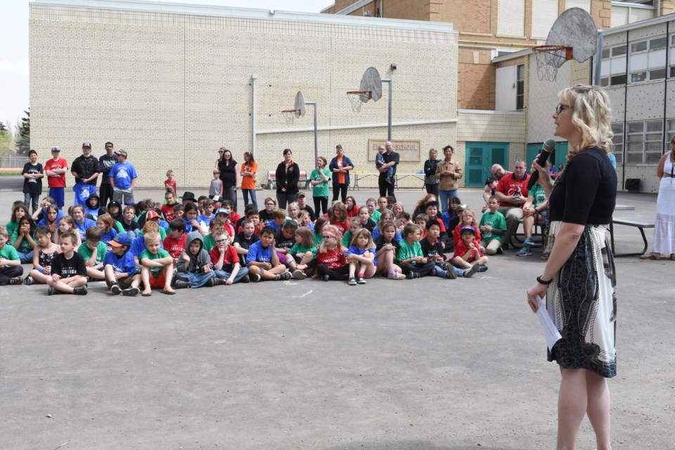 Kelly Logan, principal of Empire School, speaks about the new playground project during a ceremony on May 24. Photo by Jason G. Antonio 