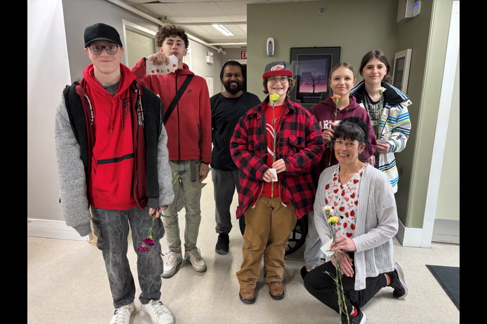 Students from Phoenix Academy delivered some Valentine's Day cheer to residents and staff at Capilano Court. Photo courtesy Christa Lapointe