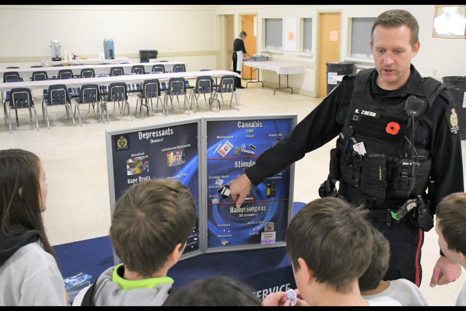 Const. Rob Zoerb with the Moose Jaw Police Service explains the different types of drugs to a group of students during the third annual Prairie South School Division Safety Day, held Nov. 6 on the exhibition grounds. Photo by Jason G. Antonio