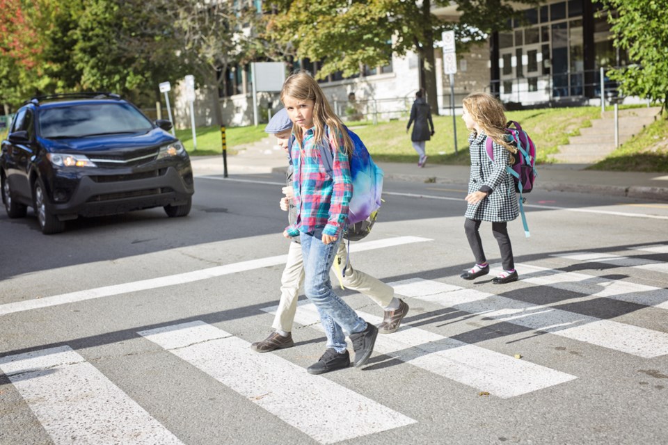 students crosswalk shutterstock