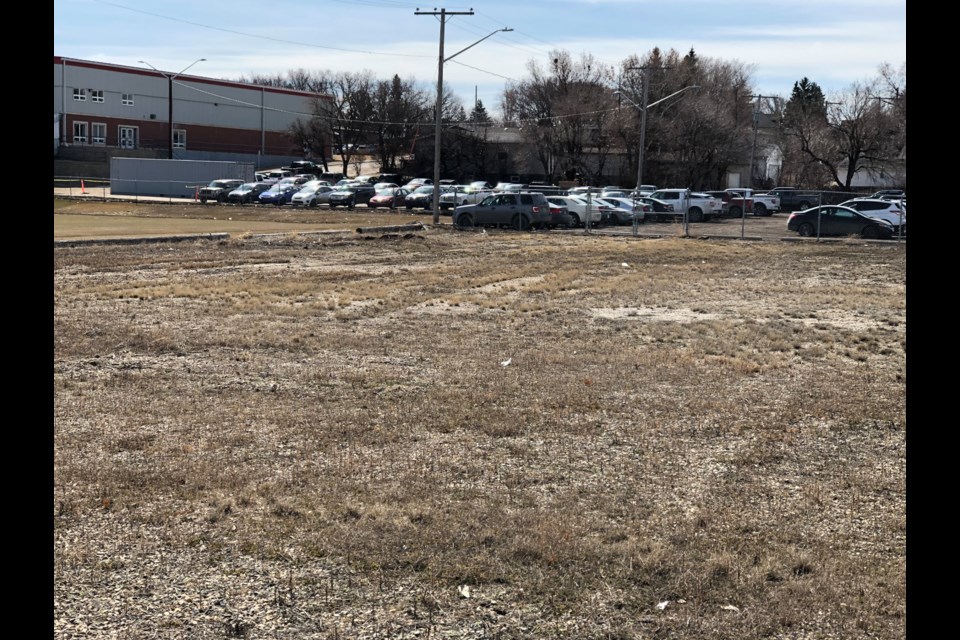 The field in the foreground will be transformed into additional parking space for students at Vanier Collegiate. The lot will also be paved. Photo by Jason G. Antonio