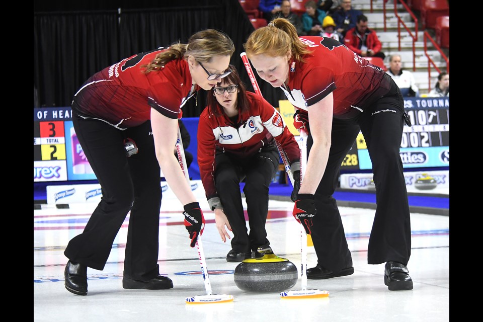 Newfoundland's Julie Devereaux and Erin Porter sweep for Erica Curtis.