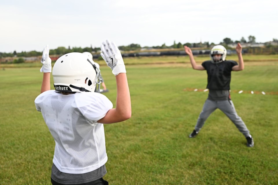 Jumping jacks at practice.