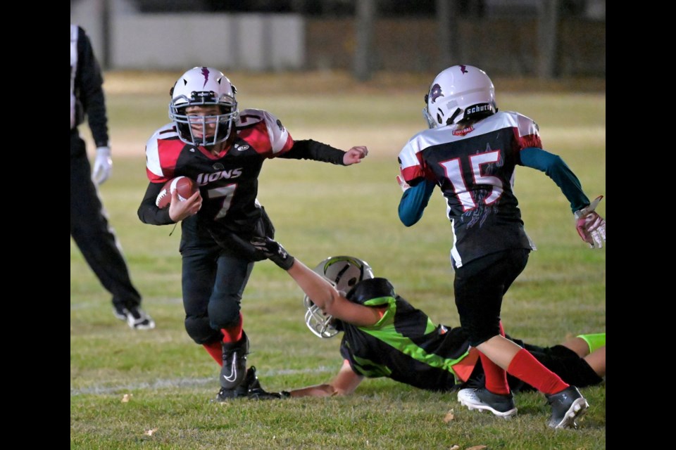 MOOSE JAW LIONS' CHAYSEN SEIFERLING (LEFT) ATTEMPTS TO GET AROUND AN ESTEVAN CHARGERS DEFENDER.