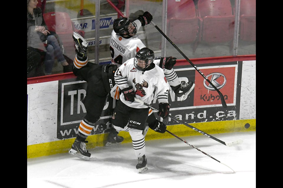 Evan Callaghan and Chris Otterson make themselves a Contacts sandwich in the corner.