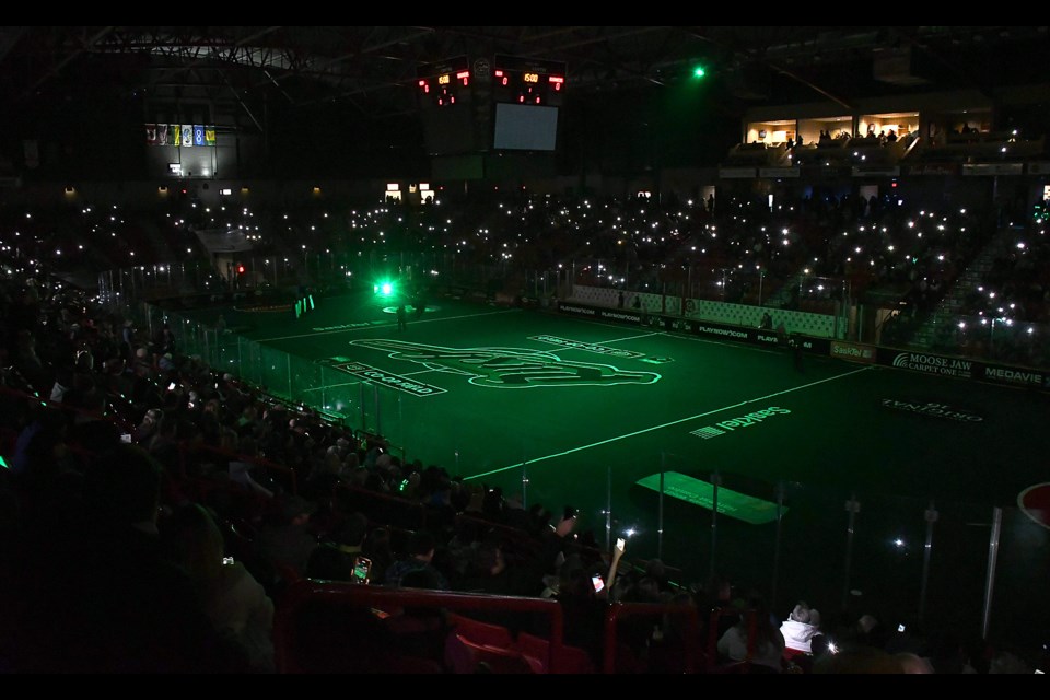 The close to 4,600 fans in attendance light up the stands during the pre-game ceremony.