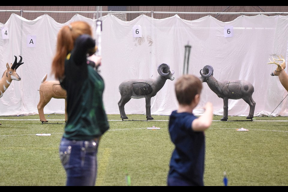 Competitors unleash a volley at a 3D Shoot target