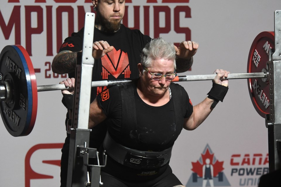 Moose Jaw’s Mava Brydges competes in the squat on her way to setting a national record during the Master’s 3 women’s powerlifting competition.