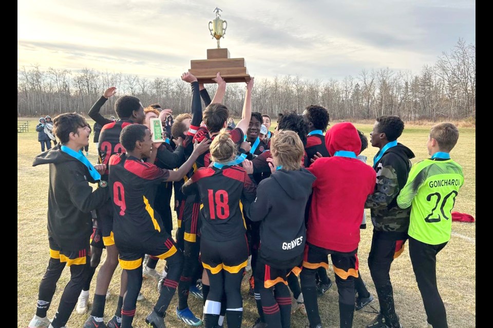 The Central Cyclones celebrate with the SHSAA 4A boys provincial championship trophy after their victory on Saturday afternoon.