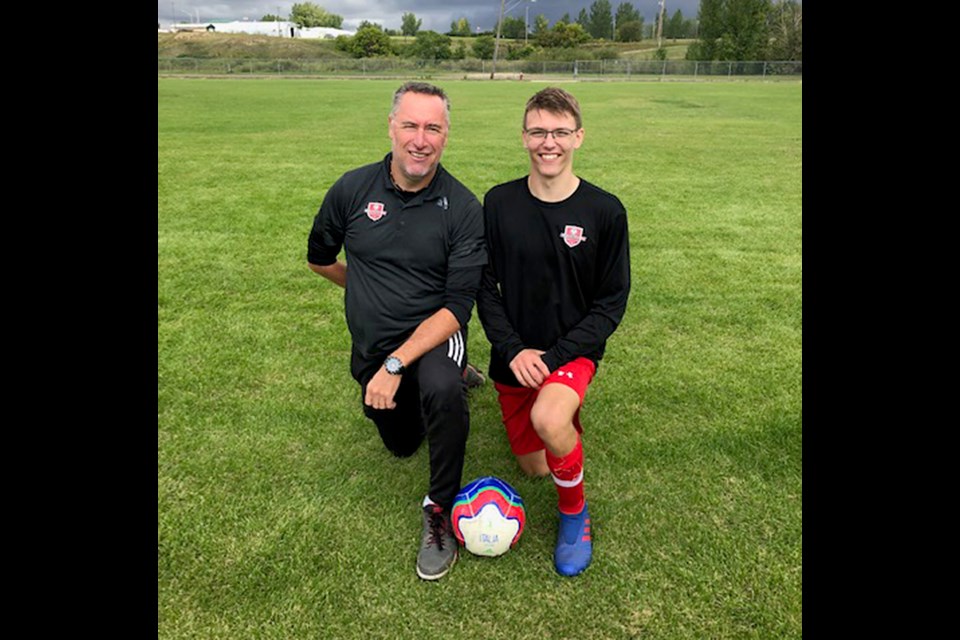 Moose Jaw soccer standout Logan Cushway with JJ Soccer coach Jason Jones.