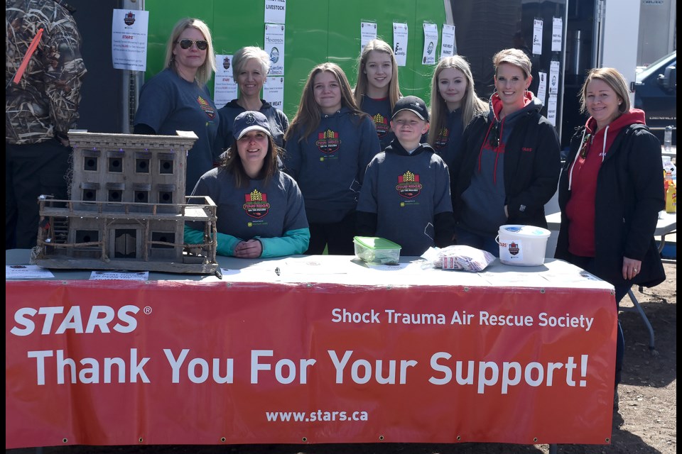 Moose Jaw’s Tereen Mowrey (back left, sunglasses) with her group of supporters during the STARS auction fundraiser on Thursday afternoon.