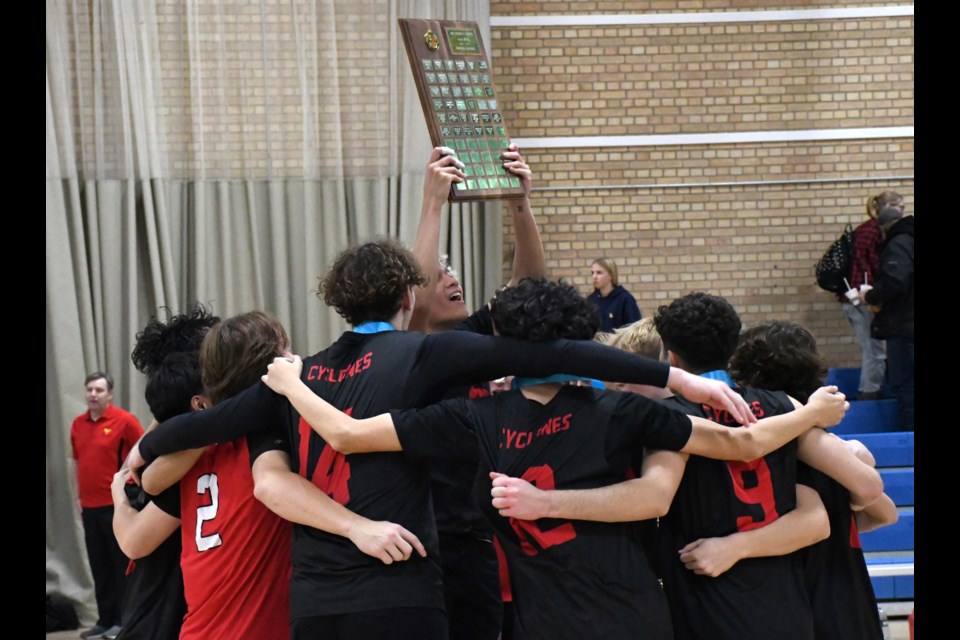 The Central Cyclones celebrate with the SHSAA 4A boys provincial championship plaque after their win over Humboldt in the gold medal game Saturday evening.