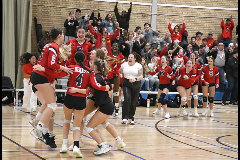 The Vanier Spirits celebrate after winning the 2023 Moose Jaw High Schools Athletic Association senior girls volleyball championship.