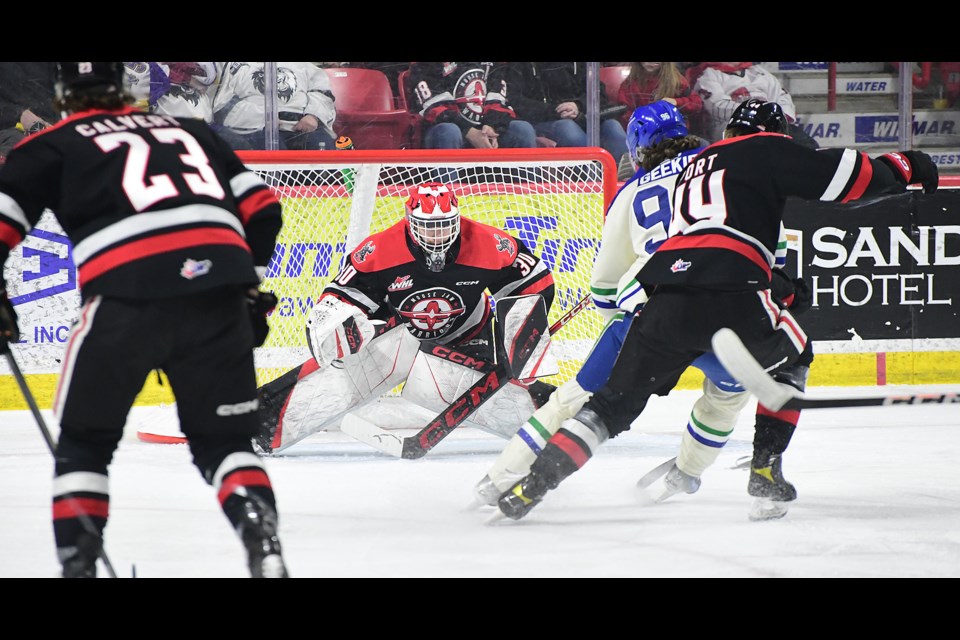 Warriors goaltender Jackson Unger makes a save in close on the Broncos’ Conor Geekie.