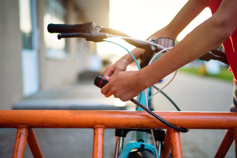 locking up bike shutterstock