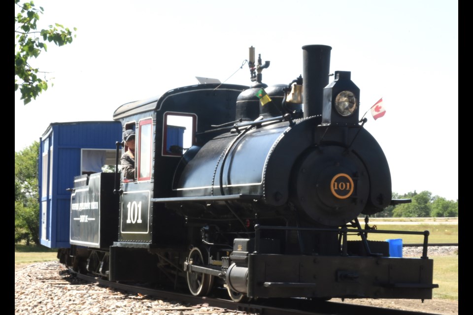 Guests hitch a ride on the K+S Potash Canada Short Line 101 steam train during "Blow Off Some Steam" at the WDM on Aug. 10.