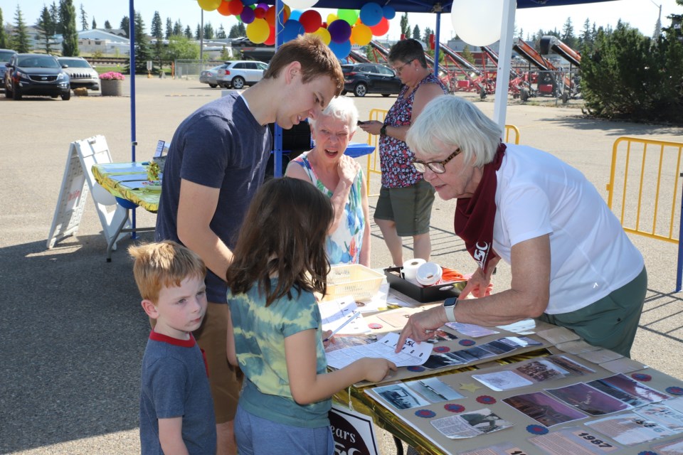 Attendees check out some of the history of Accredited Supports to the Community during its 50-year anniversary celebration.
Doug Collie/MVP Staff