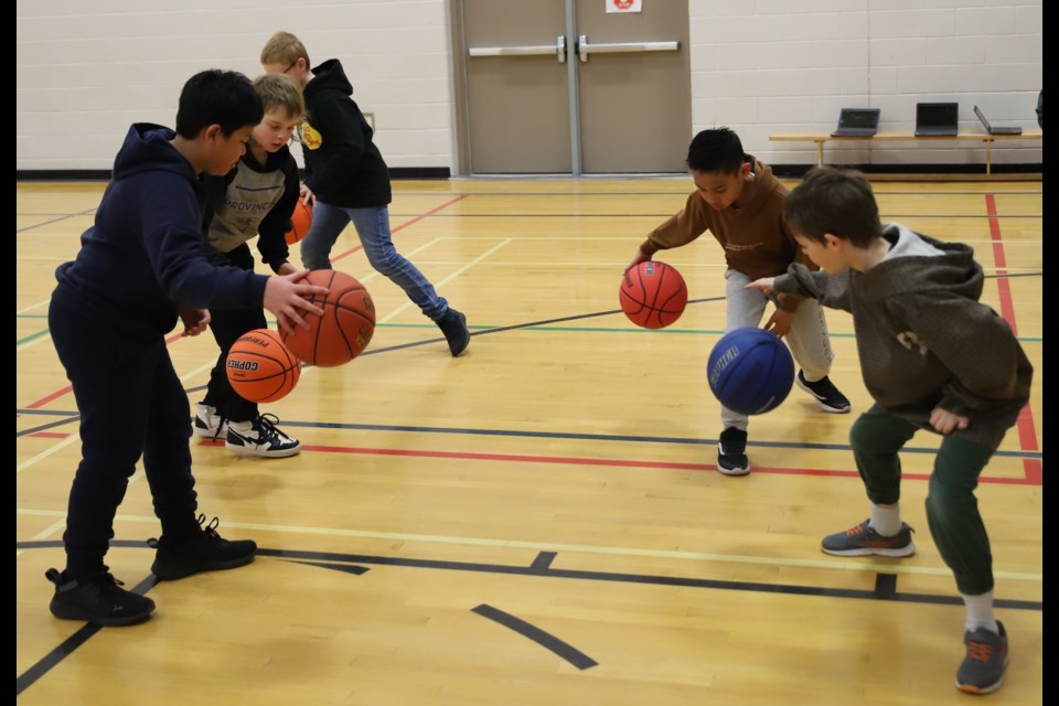 Students at Holy Trinity Catholic School participate in a basketball drill organized by teacher Kyle Young, one of the creators of the Olds Hoops Lab, an eight-week basketball camp in Olds that begins March 10.
Doug Collie/MVP Staff