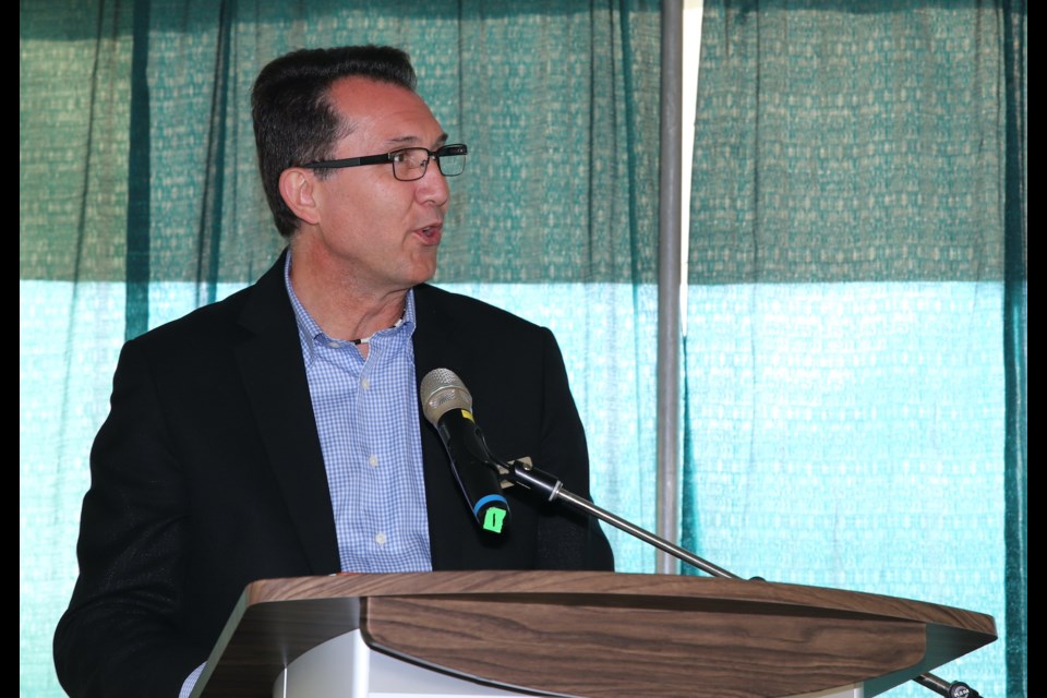 Olds College president Ben Cecil addresses the crowd during the partner of the year annoucement at AgSmart.