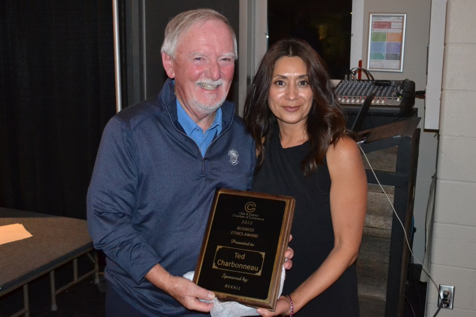 Sonia Reed of sponsor Rexall presents the Business Ethics award to Tedd Charbonneau, former owner of Tedds Foodmart.
Doug Collie/MVP Staff