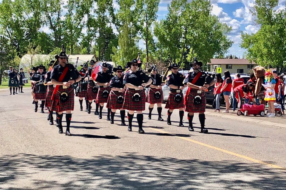 The Calgary Police Service Pipe Band marches proudly down 11th Avenue in Carstairs during the festival on Sunday.
