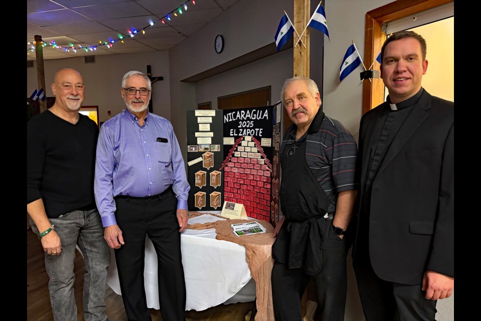 On Jan. 10 about 60 citizens from across the region and beyond attended a Nicaraguan Christmas Gala at Innisfail’s Our Lady of Peace Catholic Church to raise money for a 16-day mission to Nicaragua to build a home and 10 latrines. From left to right are St. Albert’s Phil Schmidt; David Fréchette, president of the St. Albert-based Roots of Change Foundation; Pat Spiller, a member of Innisfail’s Our Lady of Peace Catholic Church, and Father Curtis Berube, pastor of the Innisfail church. Johnnie Bachusky/MVP Staff