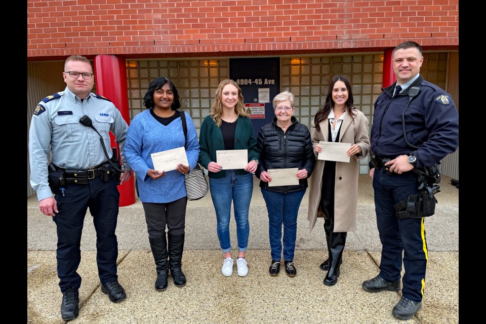 On Dec. 5 four charitable organizations were each given a cheque for $3,516; money that was collected during the 27th Annual Innisfail RCMP Charity Check Stop. From left to right is Innisfail RCMP Staff Sgt. Ian Ihme; Sue Haddow, donations coordinator for the Innisfail Christmas Bureau; Katrina Matchim, community programmer for the Town of Innisfail on behalf of Youth Positive Assets Coalition; Heather Taylor, co-coordinator of the Innisfail and District Food Bank; Alyssa Barthel, director of community development for the Central Alberta Child Advocacy Centre, and Innisfail RCMP Const. Craig Nelson, lead organizer of the 2023 charity check stop. Johnnie Bachusky/MVP Staff