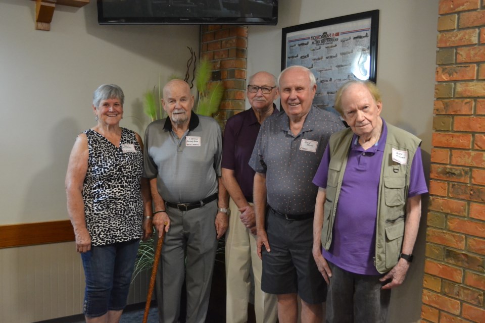 These attendees at the 65th anniversary of the Olds High School class of 1957 go all the way back together to Grade 1. From left are Doris (Descheneau) Neufeld, Duane (Chester) Dodd, Walter Schultz, Don Smith and Alex Ritchie. A fifth, Tom Johnson, was unable to be present for the photo. 
