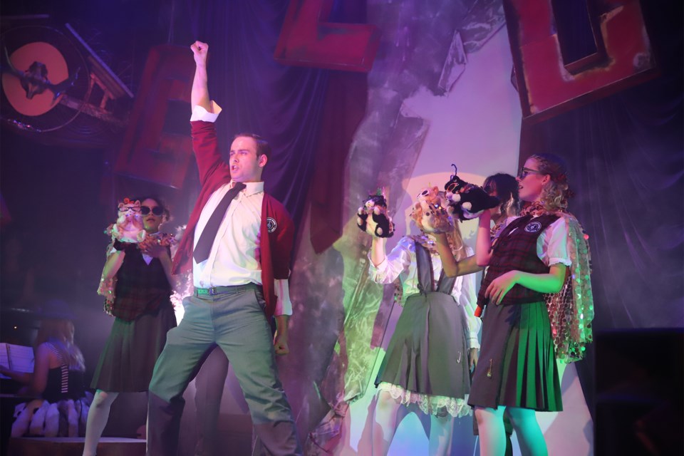 Alex Flynn-Belanger of Calgary does a John Travolta Grease-like move during Ride the Cyclone, a musical featuring several people from Olds in the production. 
Doug Collie/MVP Staff