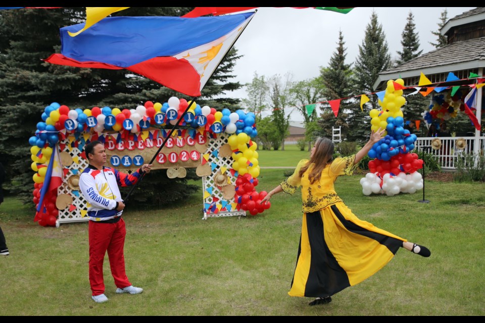 The Philippines flag was a key part of  this dance during Philippine Independence Day celebrations in Olds. 
Doug Collie/MVP Staff