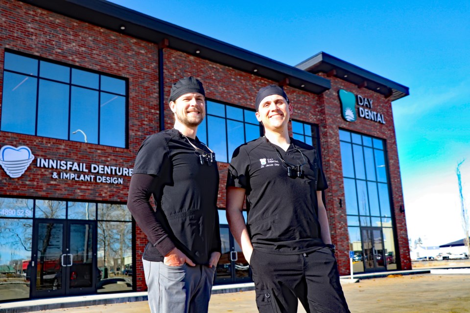 Dr. Isaac Day, left, and his brother Dr. Jacob Day, outside their recently completed 10,000 square foot Day Dental building. The siblings' new headquarters officially opened for business on March 21. Johnnie Bachusky/MVP staff