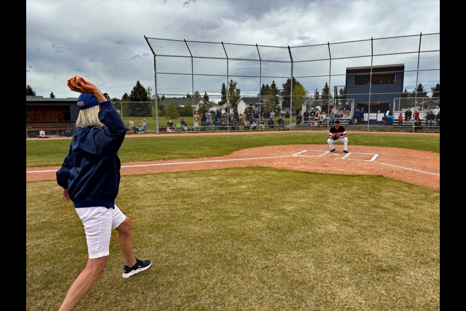 Community builder and minor baseball supporter Maymie O’Dwyer throws out the ceremonial first pitch before the alumni baseball game on June 1 between the Innisfail Merchants and Innisfail Trappers during the grand opening of the redeveloped Diamond 7 baseball field. 
Johnnie Bachusky/MVP Staff