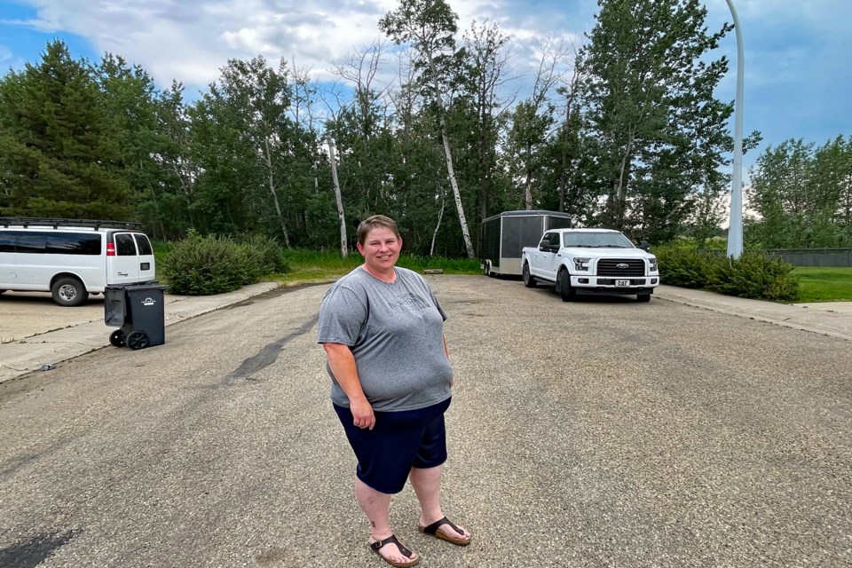 Dixie McLeod stands on the dead end road of 54 Avenue where residents joined forces to successfully convince Innisfail town council not to approve an amendment to the Woodlands Area Structure Plan that would have allowed a connector road to join 54 Avenue from the neighbouring 99-acre development area. Johnnie Bachusky/MVP Staff