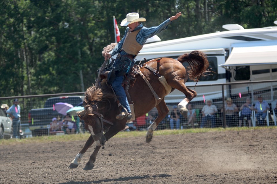  To score well in a saddle bronc competition, the rider must maintain smooth action throughout the eight-second ride.
Photo by Scott Rowan