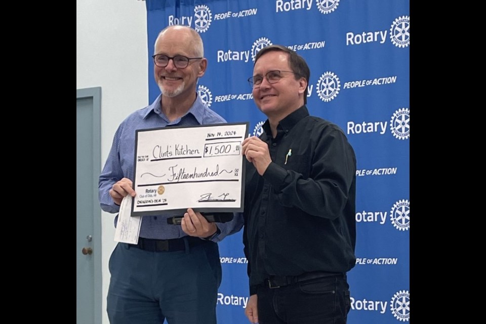 Rotary Club of Olds president Steve Turner, left presents St. Paul’s Lutheran Church pastor Olav Traa of Clint’s Kitchen with its share of the $12,000 given out.
Submitted photo