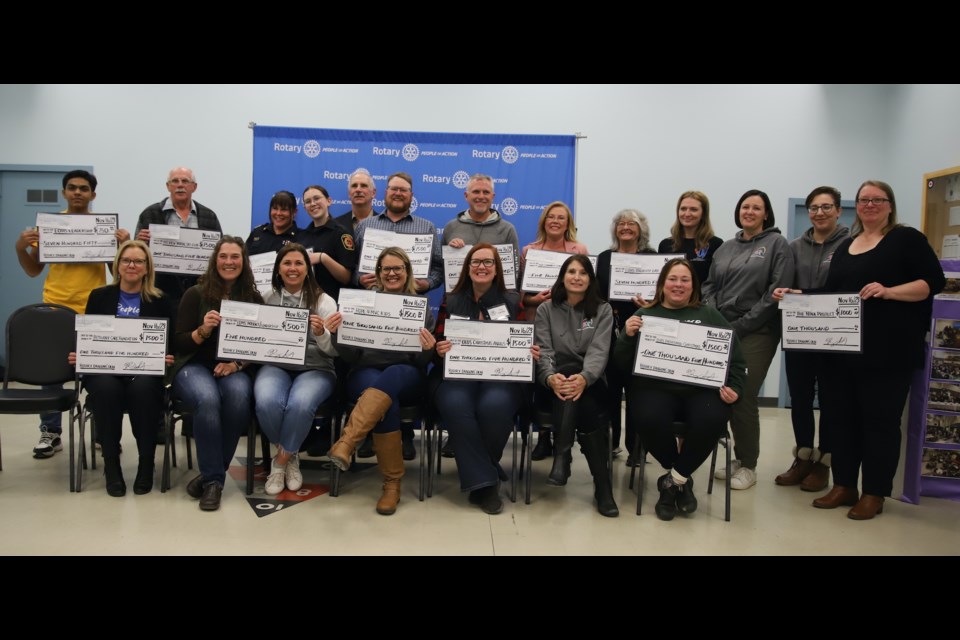 Representatives of organizations that received money during the inaugural Rotary Club of Olds Dragon’s Den pose with the cheques they received.