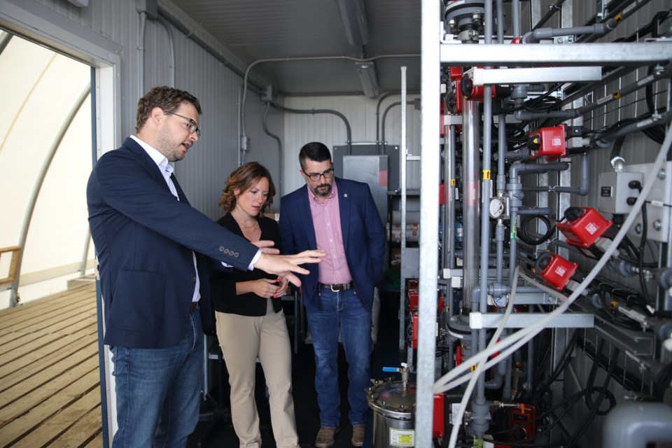 E3 Lithium president and chief executive officer Chris Doornbos, left, explains to Minister of Environment & Protected Areas Minister Rebecca Schulz and Olds-Didsbury-Three Hills MLA Nathan Cooper how the lithium extraction process works.
Doug Collie/MVP Staff