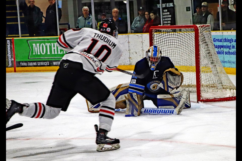 Innisfail Eagles' Chase Thudium blasts a shot on Lacombe Generals goalie Mackenzie Engel during second period action of the first game of the best of seven North Central Hockey League final series on March 8. Johnnie Bachusky/MVP Staff