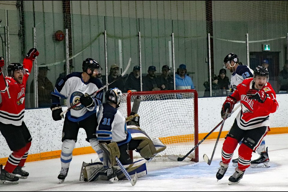 Innisfail Eagles players celebrate a goal by Dave Nippard to break a 1-1 tie in the third period in Game 4 of the North Central Hockey League finals. The Birds went on to defeat Lacombe 5-1 and take a commanding three games to one lead in the best of seven final series. 
Johnnie Bachusky/MVP Staff