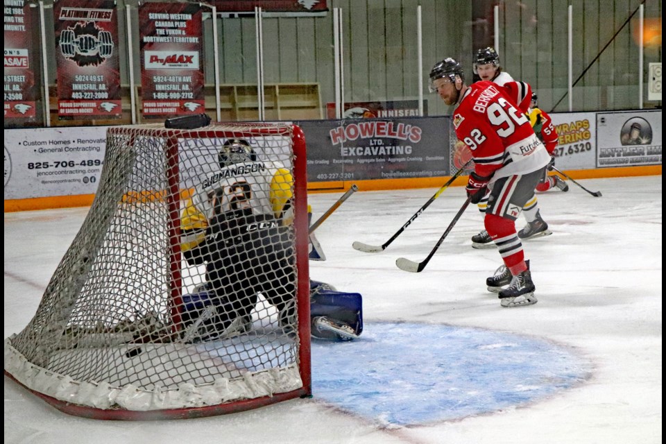 The Innisfail Eagles Tyler Berkholtz, right, scores a second period goal against the Devon Barons during the second game of the best-of-five series on Feb. 9. Innisfail went on to win the game 6 - 4 to tie the series at one game apiece. 
Johnnie Bachusky/MVP Staff