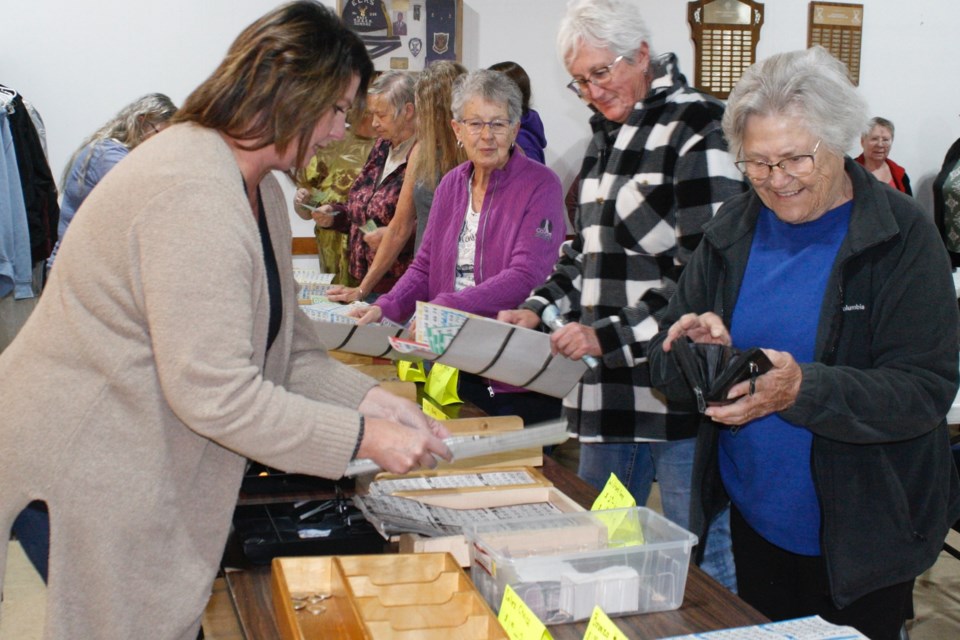 Bingo enthusiasts line up on Tuesday, Oct. 1 to get their cards for the Sundre Elks Lodge No. 338’s weekly bingo nights. That same evening was also the monthly customer appreciation when coffee and snacks are made available. 
Simon Ducatel/MVP Staff