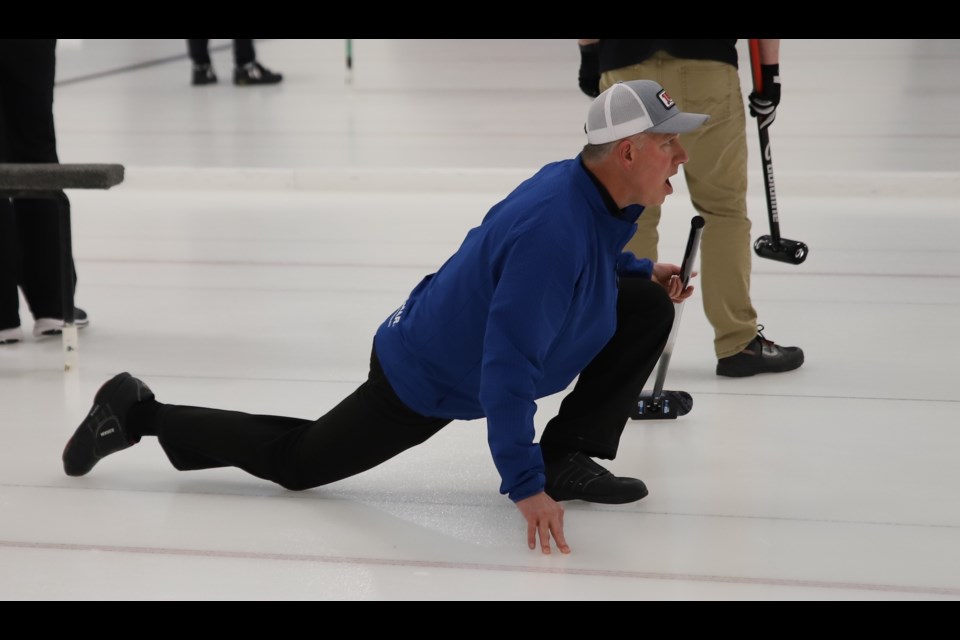 Brent Burns yells at a rock to do his bidding during the men's portion of the Olds Farmers & Farmerettes bonspiel.
Doug Collie/MVP Staff