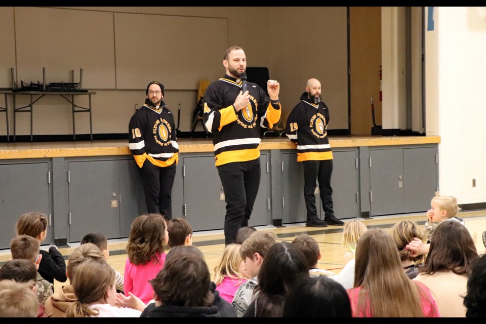 Father Daniel Corso of the Flying Fathers hockey team offers his own story of faith and hockey to students and staff at St. Marguerite Bourgeoys Catholic School on Feb. 11. Johnnie Bachusky/MVP Staff