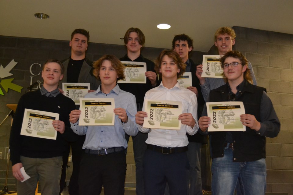 Olds High School Spartan football players pose with the awards they received during a banquet at the high school Nov. 17. From left, front row: Noah Worth, Defensive Player of the Year; Colby Pagan, Rookie Player of The Year; Blair Van Brunschot, Offensive Player of the Year; and Brock Bratrud, Most Improved Player. Back row, from left: Johnny Mullins, Lineman of the Year; Landon Erick,MVP; Parker Irving, Unsung Hero award; and Dane Drent, Offensive Player of the Year.